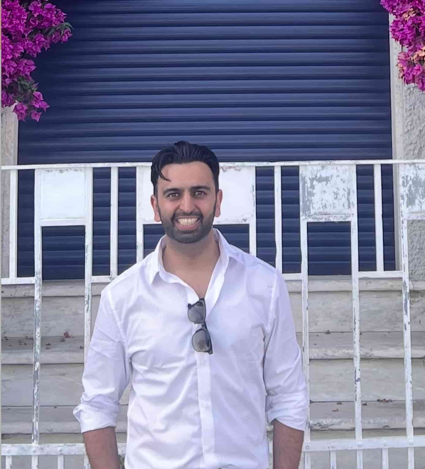 Professional headshot of Shervin Soleymanpoor, middle-aged man with short black hair wearing white shirt